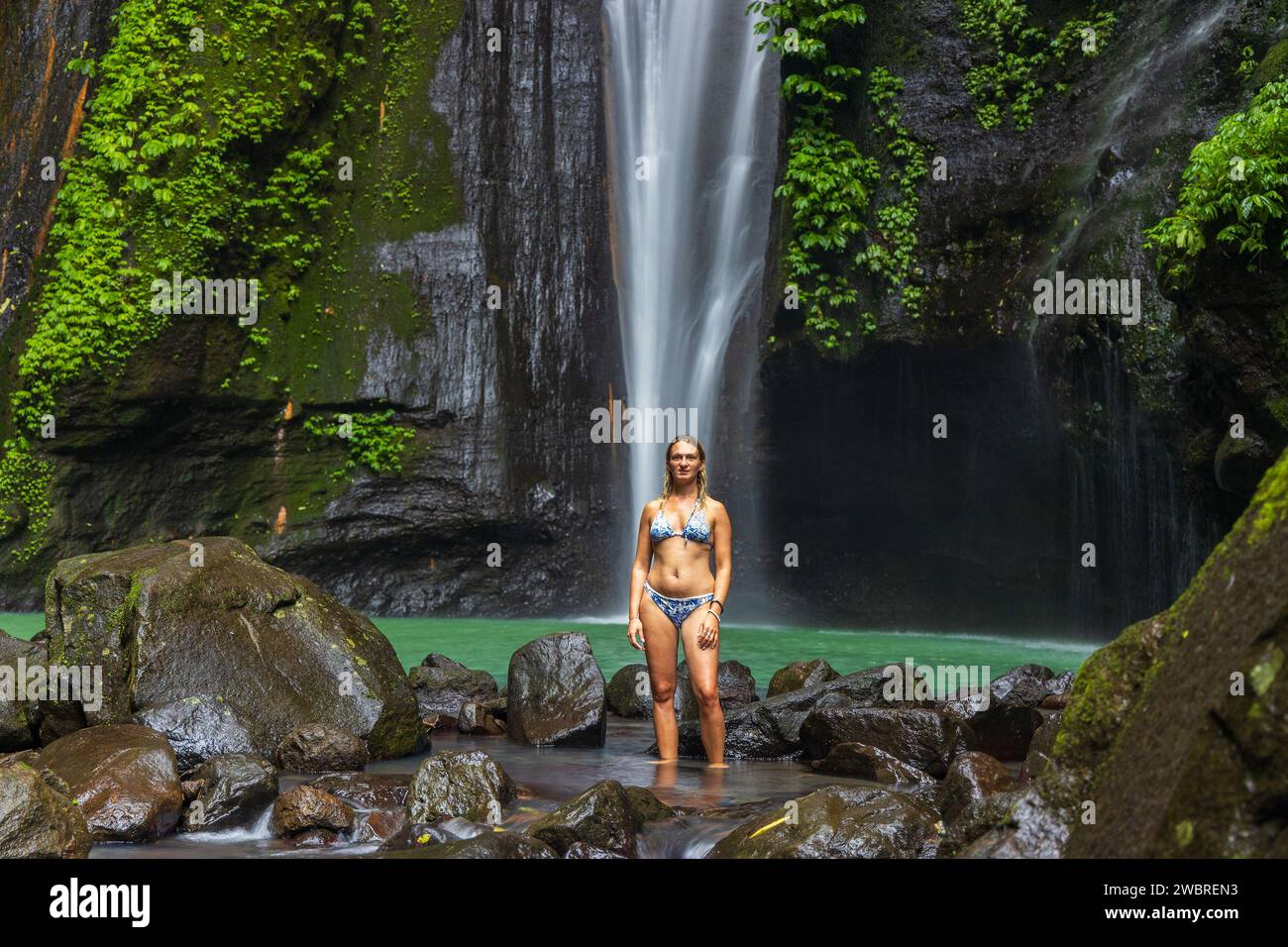A Young Woman In Swimming Suit Is Posing At Hidden Waterfall Near for Hidden Pictures Swimming Jpg