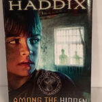 Among The Hidden (Shadow Children #1)Haddix, Margaret Peterson With Among The Hidden Pictures